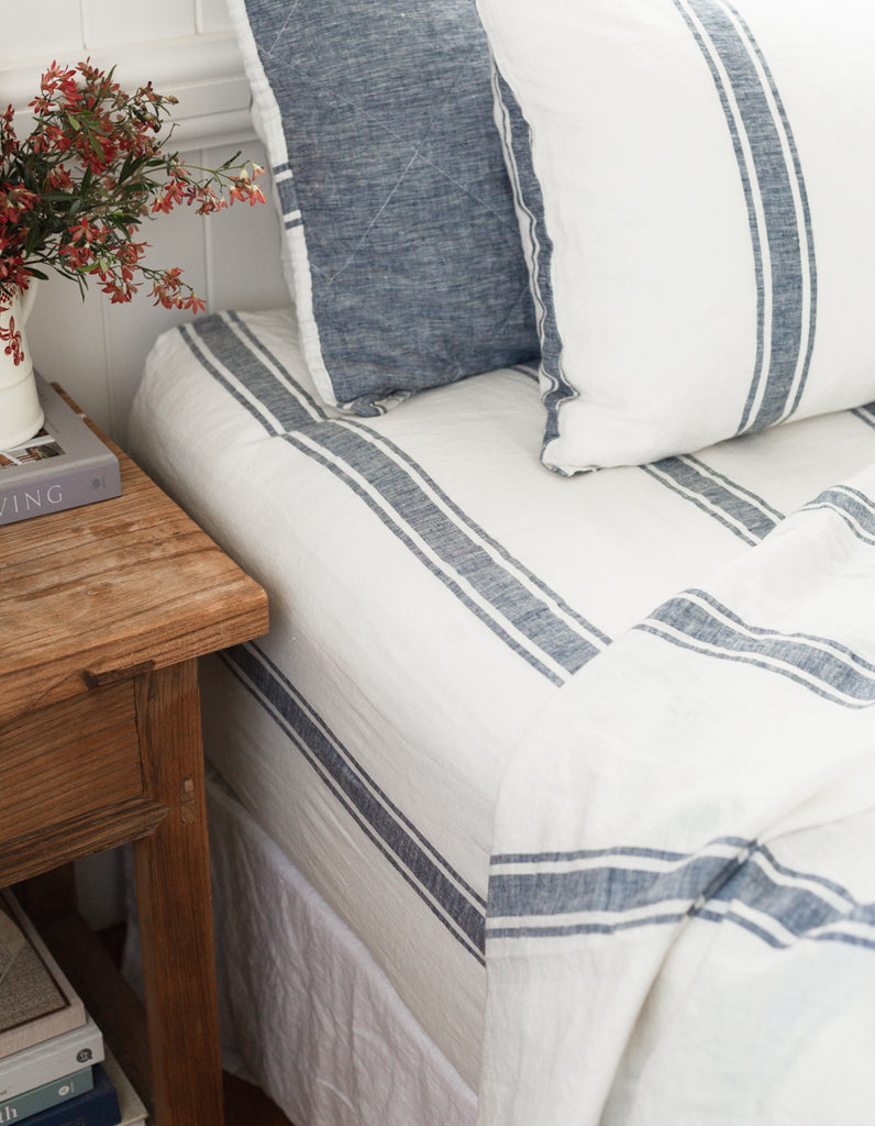 Yarn dyed woven ticking stripe linen sheet set in indigo by Salt Living